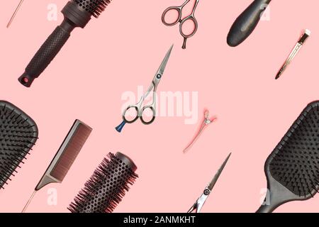 Flat lay composition with hairdresser set on pink background. Barber set with tools and equipment: scissors, combs and hairclips. Hairdresser and beau Stock Photo