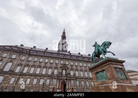 Looking up at the Christiansborg Palace and Frederik VII statue in Copenhagen, Denmark. Stock Photo