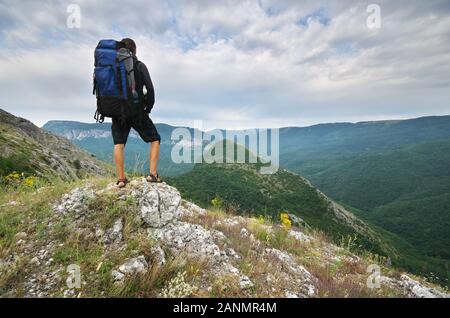 Traveler tourist in mountain. Nature composition. Stock Photo