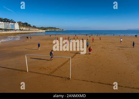 Playing Football match at Sardinero beach, Santander. Cantabria, north Spain. Europe Stock Photo