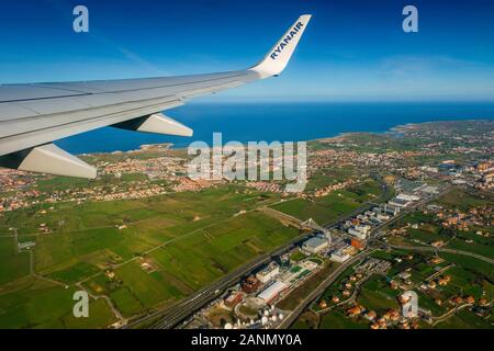 Plane flying over Santander, Cantabrian Sea. Cantabria, north Spain. Europe