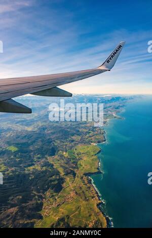 Plane flying over sea coast of Cantabria, Cantabrian Sea. North Spain. Europe Stock Photo