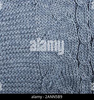 knitted warm background, element of a sweater or scarf. the texture of knitting and yarn is clearly visible Stock Photo