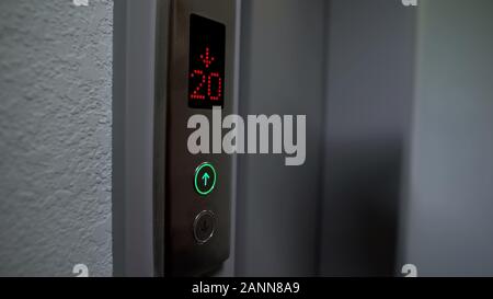 Electronic LCD elevator display showing twenty floor down, automatic system Stock Photo