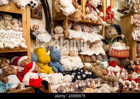 Lots of cute fluffy brown and beige teddy bears on a store counter and shelves. Toys background Stock Photo Alamy