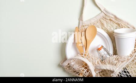 Eco-friendly Kitchen Utensils, Paper Disposable Tableware And Mesh Bag.  Wooden Cutlery And Shopping Bag On A Beige Background. Sustainable  Lifestyle. Zero Waste Concept Stock Photo, Picture and Royalty Free Image.  Image 188223475.