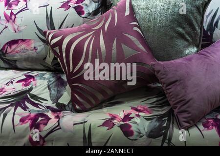 Beautiful soft pillow and blanket with white cozy bed in contemporary bedroom design ideas concept Stock Photo
