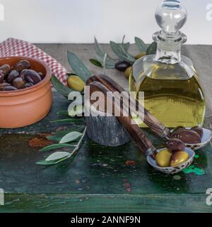 Olive oil. Kalamata Greek olives and virgin olive oil in glass container. Stock Image. Stock Photo