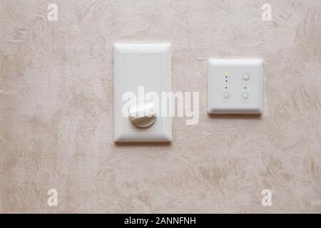 Air conditioning or heating system analog controller on the wall. Stock Photo