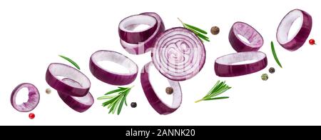 Falling sliced red onion rings isolated on white background with clipping path, with herbs and spices Stock Photo