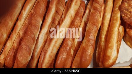 fresh rosy appetizing baguettes close up Stock Photo
