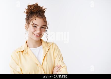 Portrait pleasant tender happy giggling nice girl redhead freckles curly  messy bun cross arms chest confident friendly pose smiling camera talking  cas Stock Photo - Alamy