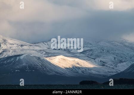 bright frozen rocky mountain range in sunset light - amazing landscape in the Arctic Stock Photo