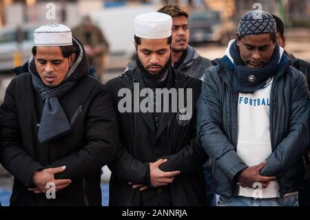 Rome, Italy. 17th Jan, 2020. The Friday prayer of Muslim migrants pray during of protest to ask the Ministry of the Interior for clarifications regarding the acquisition of Italian Citizenship and the renewal of the Permit to Stay, organized by the Dhuumcatu Onlus Association at Piazza Esquilino on January 17, 2020 in Rome, Italy. (Photo by Andrea Ronchini/Pacific Press) Credit: Pacific Press Agency/Alamy Live News Stock Photo