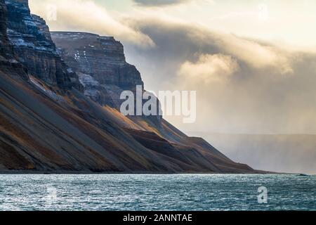 rocky mountain range with tremendous cloud formation in the Arctic - amazing polar landscape Stock Photo