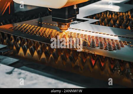 High precision CNC laser cutting metal sheet. Stock Photo