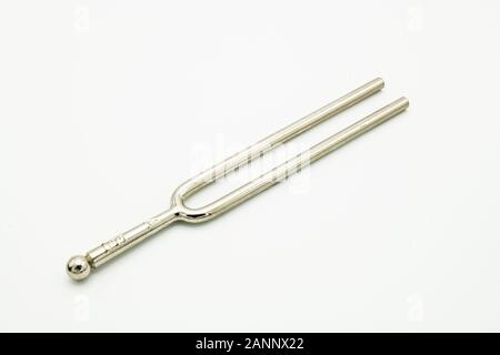 Closeup of a tuning fork 440 Hz on a white background Stock Photo