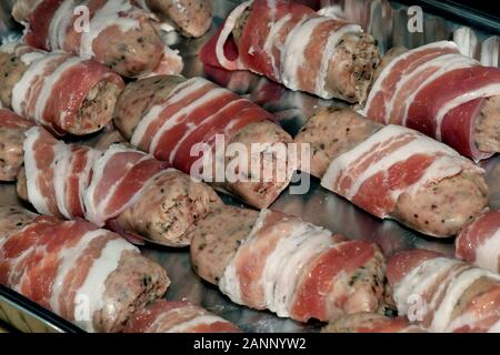 Pigs in blankets ready for the celebration dinner. Pork meat and bacon. Stock Photo