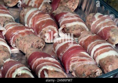 Pigs in blankets ready for the celebration dinner. Pork meat and bacon. Stock Photo