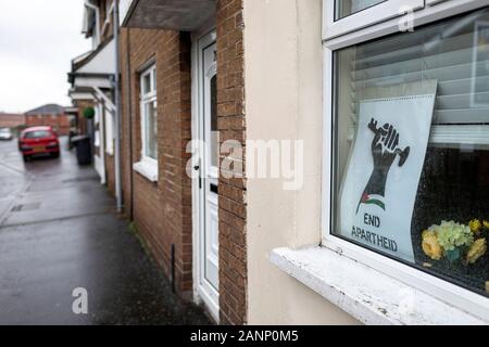 End apartheid sign on the window of typical house in Belfast, Northern Irelland Stock Photo