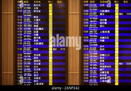 Close-up of a Hongkong airport departure information electronic display shown in chinese language Stock Photo