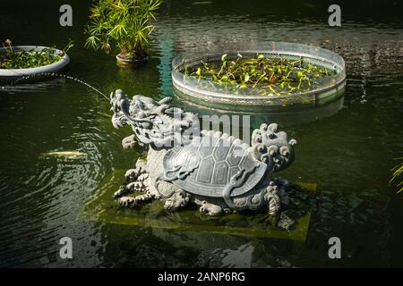 HongKong, China - November, 2019: Sculpture inside pond in  Good Wish Garden, Wong Tai Sin Temple in Hong Kong Stock Photo