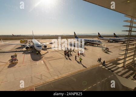 Region de Murcia International Airport, Corvera, Costa Calida, Spain, Europe. Busy with easyJet and Ryanair jet airliner planes. Passengers exiting