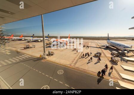 Region de Murcia International Airport, Corvera, Costa Calida, Spain, Europe. Busy with easyJet and Ryanair jet airliner planes. Passengers exiting