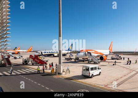 Region de Murcia International Airport, Corvera, Costa Calida, Spain, Europe. Busy with easyJet and Ryanair jet airliner planes. Passengers boarding