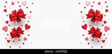 Gifts with red satin bow and hearts. Flat lay, top view, copy space Stock Photo