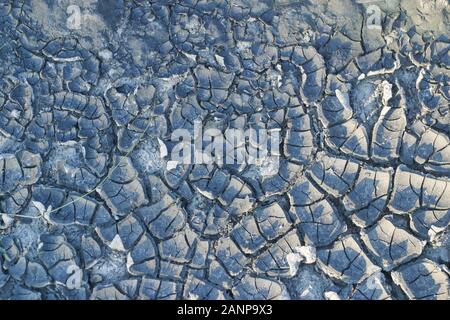 cracked soil textured background. Cracks on the dried soil in drought season Stock Photo