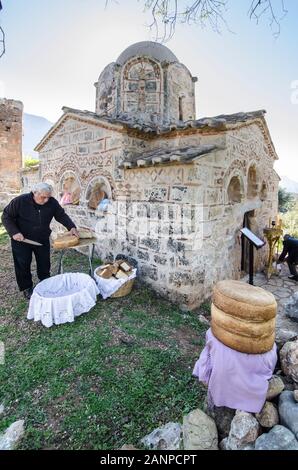 Large round loaves of the traditional 'Artos  bread', Waiting to be distributed at a Greek Orthodox, saints day, festival at the little Byzantine chur Stock Photo