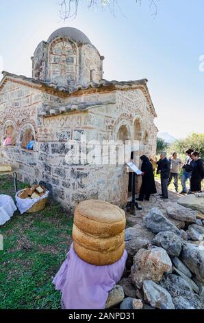 Large round loaves of the traditional 'Artos  bread', Waiting to be distributed at a Greek Orthodox, saints day, festival at the little Byzantine chur Stock Photo