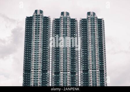 Three identical towers in the harbour of Hong Kong Stock Photo