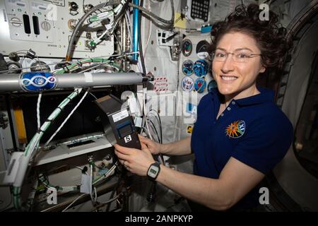 ISS - 22 Dec 2019 - NASA astronaut and International Space Station Expedition 61 Flight Engineer Christina Koch services the BioFabrication Facility ( Stock Photo