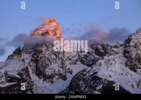 WY02865-00...WYOMING - Sunrise on the Grand Teton in Grand Teton National Park. Stock Photo