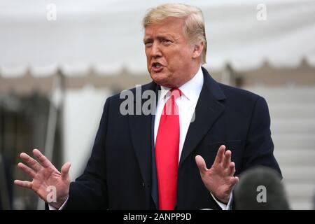 Washington, DC. 13th Jan, 2020. United States President Donald J. Trump talks to members of the media before boarding Marine One on January 13, 2020 in Washington, DC. President Trump and first lady will attend the College Football Playoff National Championship in New Orleans, Louisiana.Credit: Oliver Contreras/Pool via CNP | usage worldwide Credit: dpa/Alamy Live News Stock Photo