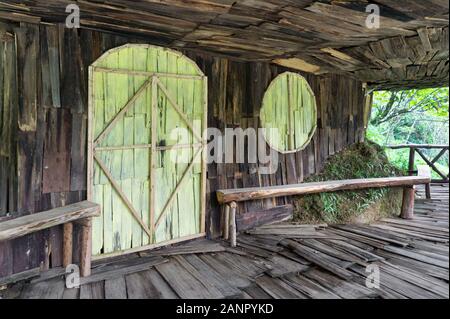 old wooden house hammered from planks. facade of planks. Vietnam Indochina Asia. Stock Photo