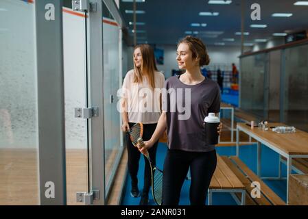 Two smiling female squash players in gym Stock Photo