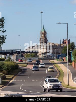 Traffic on Chester Street with Birkenhead Town Hall and Hamilton square in the background in Birkenhead, Wirral Stock Photo