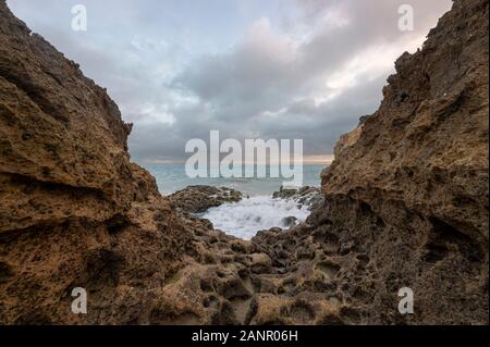 rock formation with waves at Praia de Albandeira, Algarve, Portugal Stock Photo