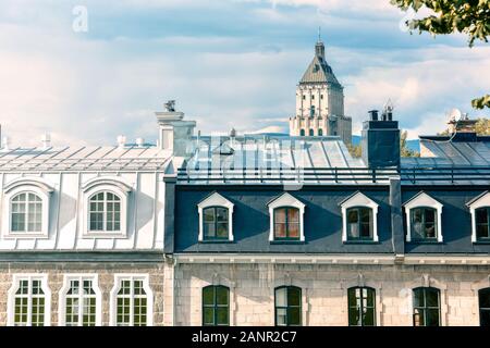 Attic windows of buildings in Quebec, Canada, on a sunny day. Real estate concept. Stock Photo