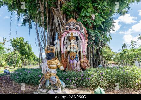 Green garden and statues in Nusa Dua area, Bali, Indonesia Stock Photo