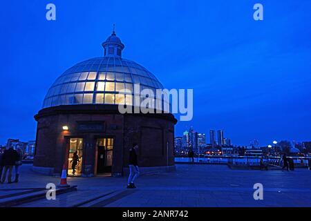 The entrance dome of the Greenwich Foot Tunnel glows in winter twilight, London. Stock Photo