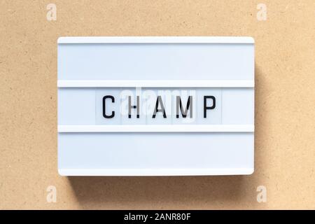 White lightbox with word champ on wood background Stock Photo
