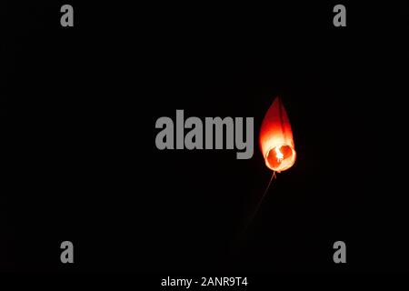 Asian Thai flying lantern on flying at night. Stock Photo