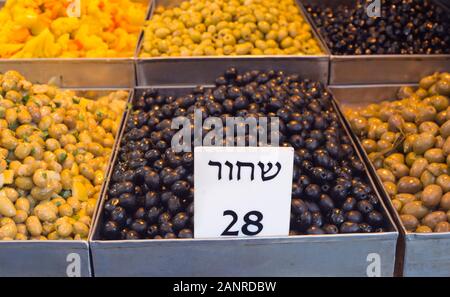 Olives on display in Mahane Yehuda market for a unit price of 28 shekels, Jerusalem Stock Photo