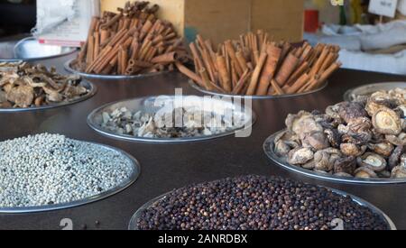 Peppercorns, mushrooms and cinnamon sticks on display in Mahane Yehuda market, Jerusalem, Israel Stock Photo