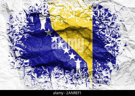 The national flag of the Bosnia Herzegovina is painted on crumpled paper. Flag printed on the sheet. Flag image for design on flyers, advertising. Stock Photo