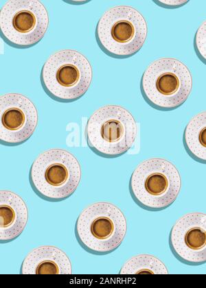 Cup of espresso coffee flat lay pattern on blue Stock Photo
